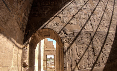 Spotlights on a wall full of hieroglyphs at the Luxor Temple, Egypt