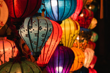 A group of colorful illuminated silk lanterns