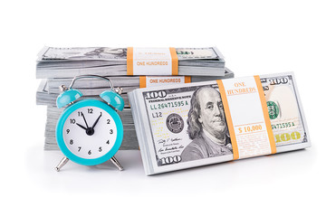United States dollars package of notes and green clock isolated on white background. Time is money financial business concept. USD 10000 by one hundreed dollar banknotes.