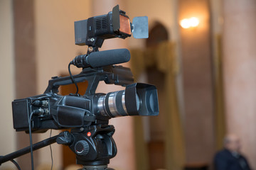 Professional production video camera . video camera set on a tripod with excellent clipping path .