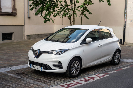 Mulhuse - France - 27 April 2020 - Front view of white Renault Zoe parked in the street, The Renault Zoe is the famous electric car by the Renault Compagny