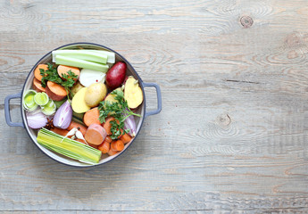 Ingredients for vegetable broth, vegetables, herbs, spices.
