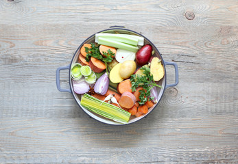 Ingredients for vegetable broth, vegetables, herbs, spices.