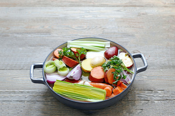 Ingredients for vegetable broth, vegetables, herbs, spices.