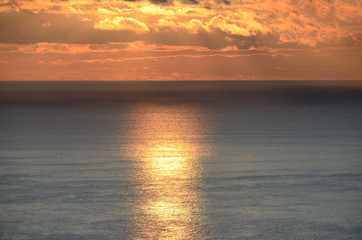Fototapeta premium Sunrise and Sunny path on the sea. Colorful view of the sea and sky with clouds.