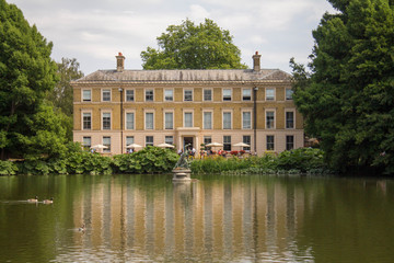 Front of the Garden Palace on Great Lake and its ducks sailing on it, London UK.