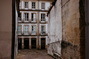 Pedestrian street in old town Santiago de Compostela on a cloudy day, Galicia