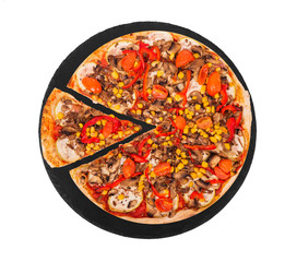 Italian pizza with mushrooms, corn, cherry tomatos, courgettes and bell peppers, with a slice removed on a slate black platter, isolated on white background, top view