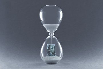 Hourglass on dark background. Concept passing traditional currency time. End of dollar currency.