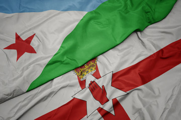 waving colorful flag of northern ireland and national flag of djibouti.