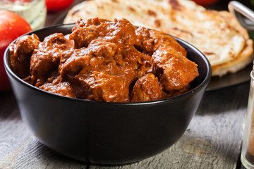 Chicken tikka masala served with bread naan