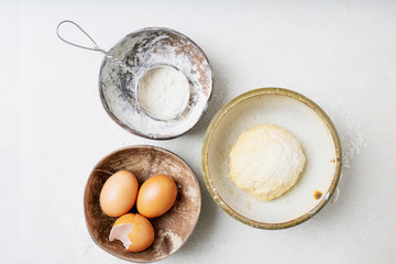 Dough Making Process. Dough ball in the bowl and ingredients.