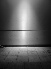 street lit by overhead light at night