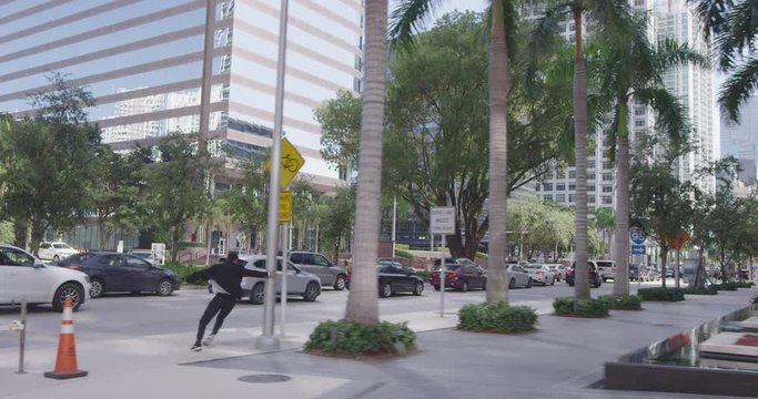 Man in suit running through city