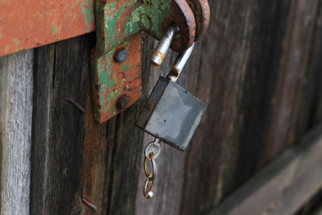 old opened lock with key inside