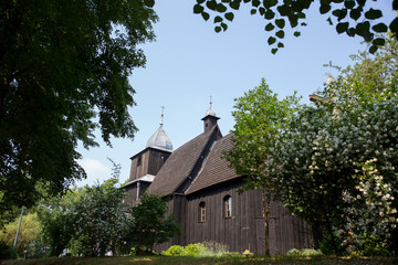 Old wooden polish church in summer