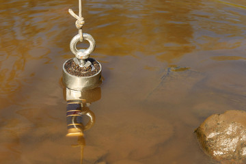 Man found hunting knife in river water by magnet