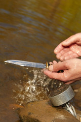Man found hunting knife in river water by magnet