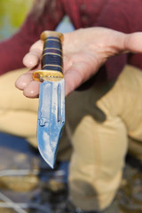 Man found hunting knife in river water by magnet