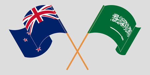 Crossed and waving flags of New Zealand and the Kingdom of Saudi Arabia