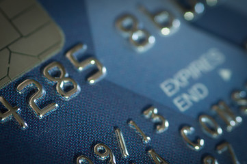 Close-up details of a blue credit card.