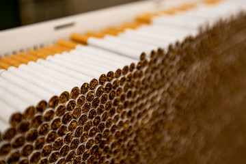 A factory producing a lot of cigarettes.