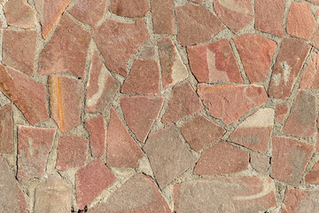 Decorative mosaic of natural broken stone tiles as background.