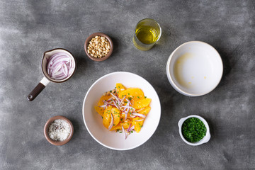 Making orange salad. All ingredients are ready on the table. Vegetarian, vegan lunch, snack or dinner. 