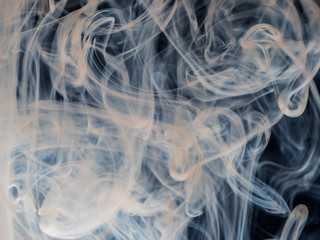 Mixing Dettol antiseptic liquid with water. Creates abstract cloud type patterns, swirls and turns white. Dettol helps kill viruses, bacteria and germs around the home. Coronavirus protection.