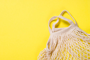 Mesh bag for zero waste shopping on color background.