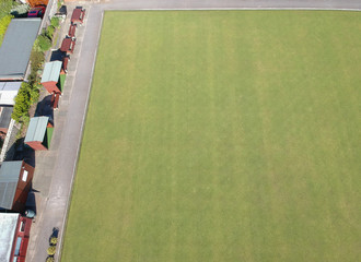 An empty bowling green on a hot summers day, empty due to the coronavirus lockdown during the corona virus covid 19 epidemic pandemic. Empty public spaces 