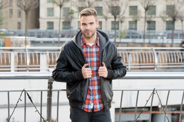 Male fashion. Waiting for you. Just relaxing here. Man wearing leather jacket. Street style. Portrait guy outdoors. Menswear concept. Fashion outfit. Urban man. Personal style. Handsome student