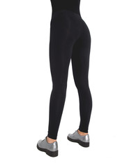 Woman wear black blank leggings mockup, isolated, clipping path. Women in clear leggins template. Sport pantaloons stretch tights model wearing. Slim legs in apparel.