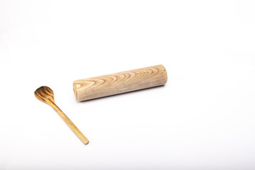 wooden spoon and rolling pin on white background
