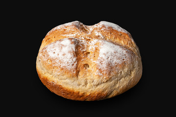Round bread. Peasant bread is isolated on a black background.
