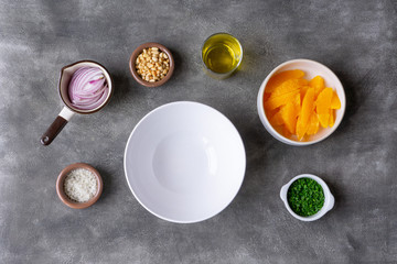 Preparing to make orange salad. All ingredients are ready on the table. Vegetarian, vegan lunch, snack or dinner. 