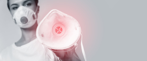 Woman is put on a face mask on someone for protection against virus