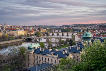 Fototapeta na wymiar Prague river with bridges preparing for the night after sunset