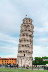 Fototapeta na wymiar Historic leaning Tower of Pisa on a cloudy day