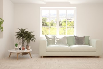 White living room with sofa and summer landscape in window. Scandinavian interior design. 3D illustration