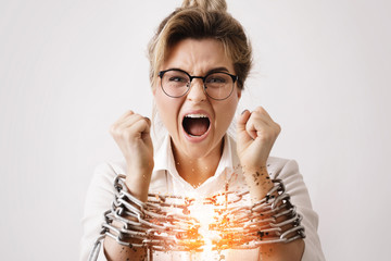 Businesswoman tied up with a chains is screaming