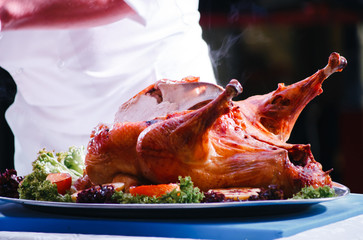 the cook cuts the fried turkey