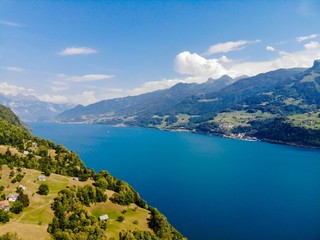 Fototapeta na wymiar Aerial view on Walensee (Lake Walen) nearby Beltis, Weesen, Amden. Canton St. Galen, Glarus, Switzerland