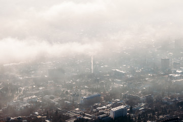 Fototapeta premium aerial view of the city through the clouds
