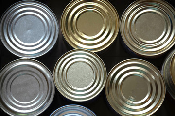 Silver food steel cans in cardboard box closeup food delivery