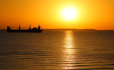 ship on the background of the Golden sunrise