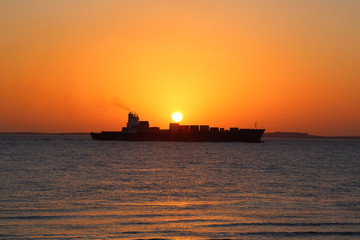 ship on the background of the Golden sunrise