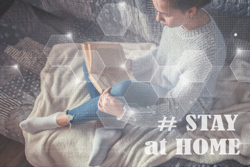 Cold autumn or winter weekend while reading a book and drinking Lazy day with cat on the sofa. Cosy scene, hygge concept