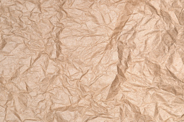 Texture of crumpled low-quality recycled brown paper