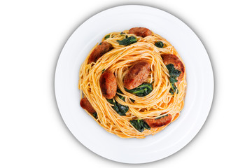 Tomato Spinach Sausage Pasta in a white plate on a white isolated background